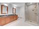Modern bathroom featuring double sinks, granite counters, and glass shower at 4525 Dean Martin Dr # 909, Las Vegas, NV 89103