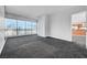 Spacious bedroom with neutral carpet, large windows providing city views at 4525 Dean Martin Dr # 909, Las Vegas, NV 89103