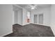 Bedroom featuring plush carpet with ensuite bathroom and sliding door closet at 4525 Dean Martin Dr # 909, Las Vegas, NV 89103