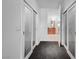 Hallway with sliding glass doors leads to a view of the modern bathroom at 4525 Dean Martin Dr # 909, Las Vegas, NV 89103