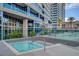 Tranquil hot tub area with glass surround and palm trees, perfect for relaxation and rejuvenation at 4525 Dean Martin Dr # 909, Las Vegas, NV 89103