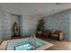 Relaxing hot tub area with textured walls, a statue, and armchairs at 4525 Dean Martin Dr # 909, Las Vegas, NV 89103