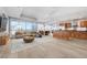 Open-concept living space featuring wood floors, cityscape views, and modern kitchen at 4525 Dean Martin Dr # 909, Las Vegas, NV 89103