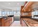 Well-appointed kitchen with granite counters, stainless appliances, and open to the living area at 4525 Dean Martin Dr # 909, Las Vegas, NV 89103