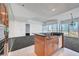 Stylish kitchen with granite countertops, an island, and open views of the living room at 4525 Dean Martin Dr # 909, Las Vegas, NV 89103