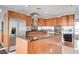 Modern kitchen boasts wood cabinetry, stainless steel appliances, and granite countertops at 4525 Dean Martin Dr # 909, Las Vegas, NV 89103