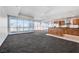 Open living area boasts expansive windows, a modern kitchen, and spacious design at 4525 Dean Martin Dr # 909, Las Vegas, NV 89103