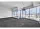 Bright living space showcasing floor-to-ceiling windows with striking city skyline views at 4525 Dean Martin Dr # 909, Las Vegas, NV 89103