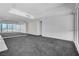 A well lit living room featuring an open floor plan, neutral carpet, and bright natural lighting at 4525 Dean Martin Dr # 909, Las Vegas, NV 89103
