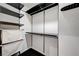 Walk-in closet featuring black metal shelving system, hanging racks, and storage at 4525 Dean Martin Dr # 909, Las Vegas, NV 89103
