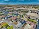 A neighborhood aerial view shows a home and surrounding houses with desert landscaping, wide streets, and mountain horizon in the distance at 4861 Ridgewood, Pahrump, NV 89061