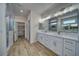 Luxurious bathroom features double sinks, marble countertops, a walk-in shower, and closet at 4861 Ridgewood, Pahrump, NV 89061