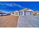 Charming single-story home boasting a two-car garage and desert landscaping, perfect for low maintenance at 4861 Ridgewood, Pahrump, NV 89061