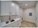 Laundry room featuring sleek white cabinets and granite-look countertop at 4861 Ridgewood, Pahrump, NV 89061