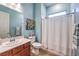 Bright bathroom featuring a shower-tub, vanity, and a window that allows natural light at 489 Open Hill Ave, Henderson, NV 89011