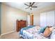Comfortable bedroom with a ceiling fan, complemented by stylish furniture and decor at 489 Open Hill Ave, Henderson, NV 89011