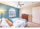 Comfortable bedroom with a large window, complemented by stylish furniture and decor at 489 Open Hill Ave, Henderson, NV 89011