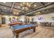 Spacious billiard room featuring a pool table, poker tables, and comfortable seating for social events at 489 Open Hill Ave, Henderson, NV 89011