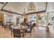 Charming dining area featuring elegant lighting, comfortable seating, and views of the community at 489 Open Hill Ave, Henderson, NV 89011