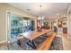 Dining room with bench seating, stylish light fixture, and sliding doors to the backyard at 489 Open Hill Ave, Henderson, NV 89011