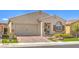 Charming single-story home featuring a well-manicured lawn, desert landscaping, and a two-car garage at 489 Open Hill Ave, Henderson, NV 89011