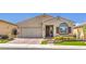 Inviting single-story home with a brick driveway, manicured lawn, and a charming front entrance at 489 Open Hill Ave, Henderson, NV 89011