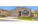 Charming single-story home featuring a well-manicured lawn, desert landscaping, and a two-car garage at 489 Open Hill Ave, Henderson, NV 89011