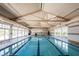 Spacious indoor pool offers a great recreational amenity with natural light from surrounding windows at 489 Open Hill Ave, Henderson, NV 89011