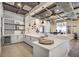 Stylish kitchen area with white cabinetry, modern appliances, and ample counter space for entertaining at 489 Open Hill Ave, Henderson, NV 89011