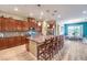 Well-appointed kitchen with stainless steel appliances, granite countertops, and a large center island with bar seating at 489 Open Hill Ave, Henderson, NV 89011