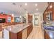 Spacious kitchen with granite countertops, stainless steel appliances, a large island, and wood cabinets at 489 Open Hill Ave, Henderson, NV 89011