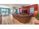 Spacious living room with hardwood floors, a large sectional sofa, and sliding glass doors to the patio at 489 Open Hill Ave, Henderson, NV 89011