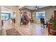 Open-concept living area featuring hardwood floors and an abundance of natural light at 489 Open Hill Ave, Henderson, NV 89011