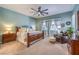 Tranquil main bedroom offering plush carpet, a ceiling fan, and ample natural light at 489 Open Hill Ave, Henderson, NV 89011