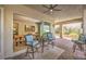Inviting covered patio with comfortable seating area and view into the dining room at 489 Open Hill Ave, Henderson, NV 89011