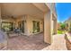 Covered patio features brick pavers, an outdoor ceiling fan, and seamless access to the backyard at 489 Open Hill Ave, Henderson, NV 89011