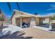 Backyard with covered patio, gravel, and block wall fencing for privacy at 5116 Blue Onion Cir, North Las Vegas, NV 89031