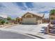 Charming one-story home with a two-car garage and a well-maintained front yard at 5116 Blue Onion Cir, North Las Vegas, NV 89031
