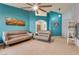 Spacious living room with tiled floors, comfortable seating, and stylish decor at 5116 Blue Onion Cir, North Las Vegas, NV 89031