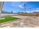 The expansive backyard has a new patch of green grass and mature landscaping at 5200 Blanton Dr, Las Vegas, NV 89122