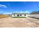 Back of the home with xeriscaping and an installed patch of green grass at 5200 Blanton Dr, Las Vegas, NV 89122