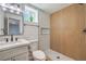 Stylish bathroom featuring modern fixtures, a walk-in shower, and neutral-toned tiles at 5200 Blanton Dr, Las Vegas, NV 89122