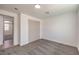 Bedroom with neutral carpet, white walls, trim and a sliding door closet at 5200 Blanton Dr, Las Vegas, NV 89122