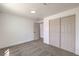 Bedroom with neutral carpet, white walls, trim and a sliding door closet at 5200 Blanton Dr, Las Vegas, NV 89122