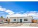 Well-maintained single-story house featuring gravel landscaping and a blue door at 5200 Blanton Dr, Las Vegas, NV 89122