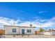 Inviting single-story home featuring desert landscaping and a blue front door at 5200 Blanton Dr, Las Vegas, NV 89122