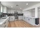 Bright kitchen with stainless steel appliances, gray cabinets and black tile backsplash at 5200 Blanton Dr, Las Vegas, NV 89122
