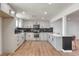 Modern kitchen featuring stainless steel appliances and gray cabinetry with black hardware at 5200 Blanton Dr, Las Vegas, NV 89122