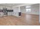 Updated kitchen featuring stainless appliances, white cabinets, and open floor plan to living area at 5200 Blanton Dr, Las Vegas, NV 89122