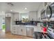 Beautiful kitchen featuring modern cabinetry, stainless appliances, black subway tile, and backyard view at 5200 Blanton Dr, Las Vegas, NV 89122